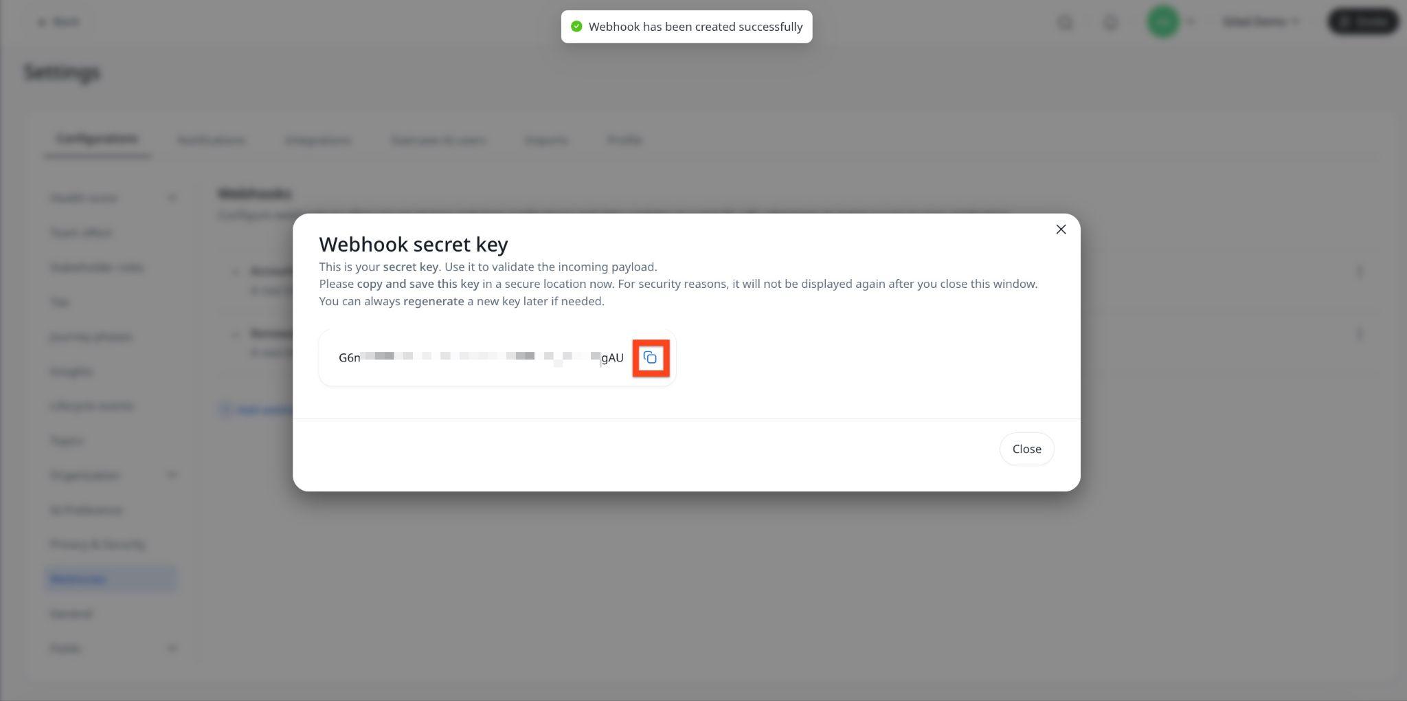 Webhook secret key dialog displaying generated validation key with copy option after successful webhook creation for secure payload verification.